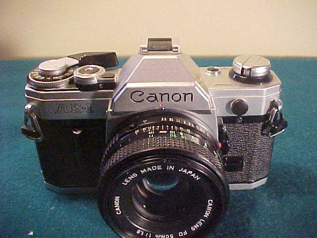 Lot of 3 Very Nice Vintage Canon 35mm Cameras W/Accessories Lot of 3 Very Nice Vintage Canon 35mm Cameras W/Accessories