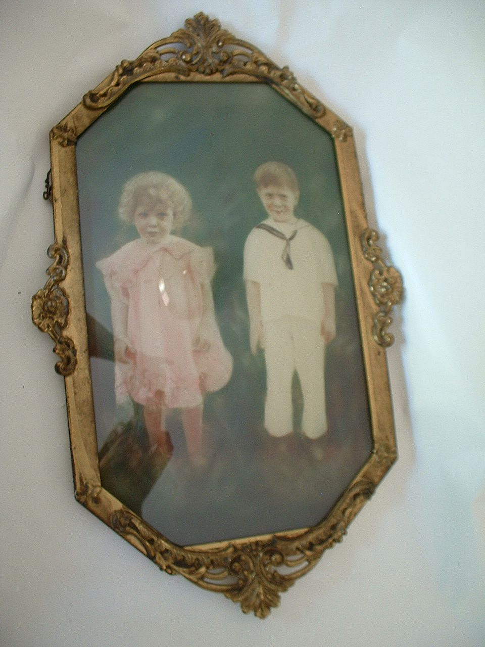 Cutest Kids Hand Colored Photograph in Metal Oval Frame with Bubble Glass Cutest Kids Hand Colored Photograph in Metal Oval Frame with Bubble Glass