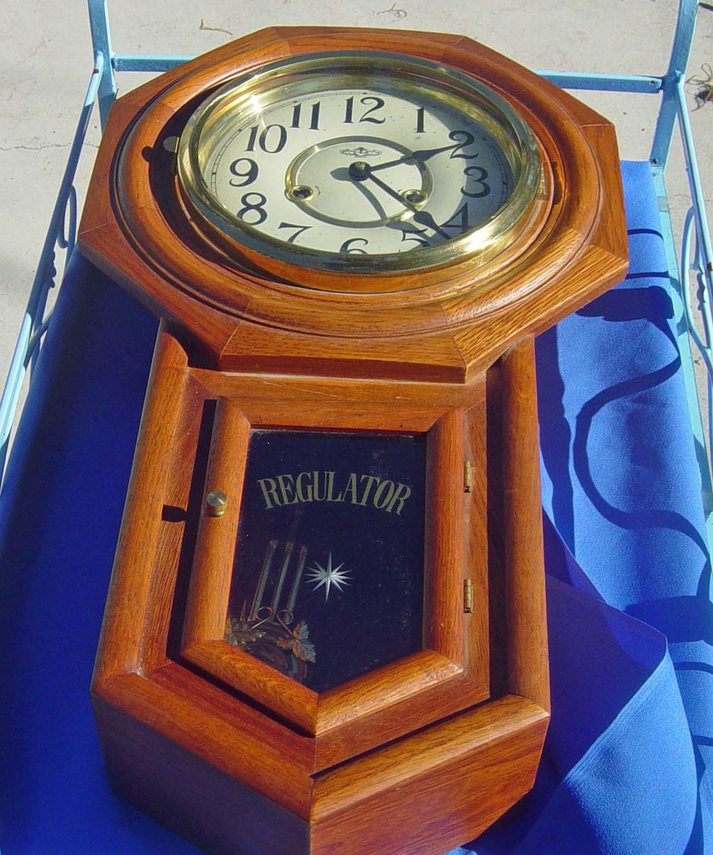D & A Regulator Style Oak Finish Wall Clock D & A Regulator Style Oak Finish Wall Clock
