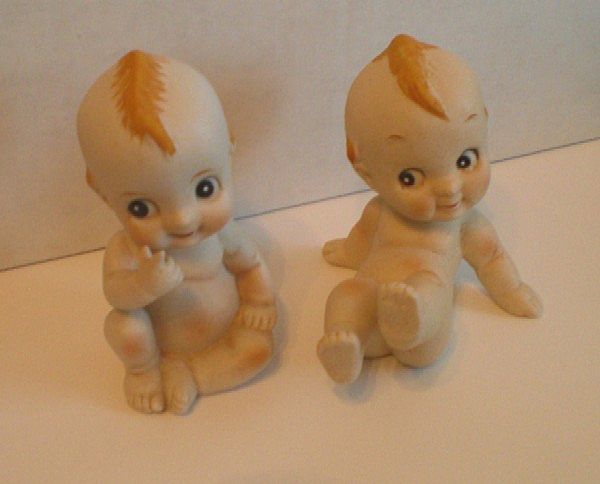 Two Porcelain Bisque Kewpie Figurines Two Porcelain Bisque Kewpie Figurines