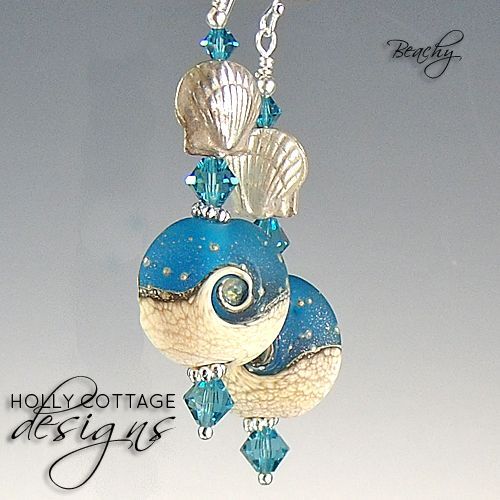 Artisan crafted lampwork and crystal earrings with silver seashells Artisan crafted lampwork and crystal earrings with silver seashells