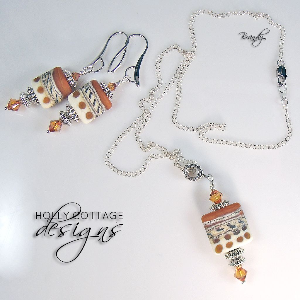 Artisan crafted lampwork pendant on chain with matching earrings Artisan crafted lampwork pendant on chain with matching earrings