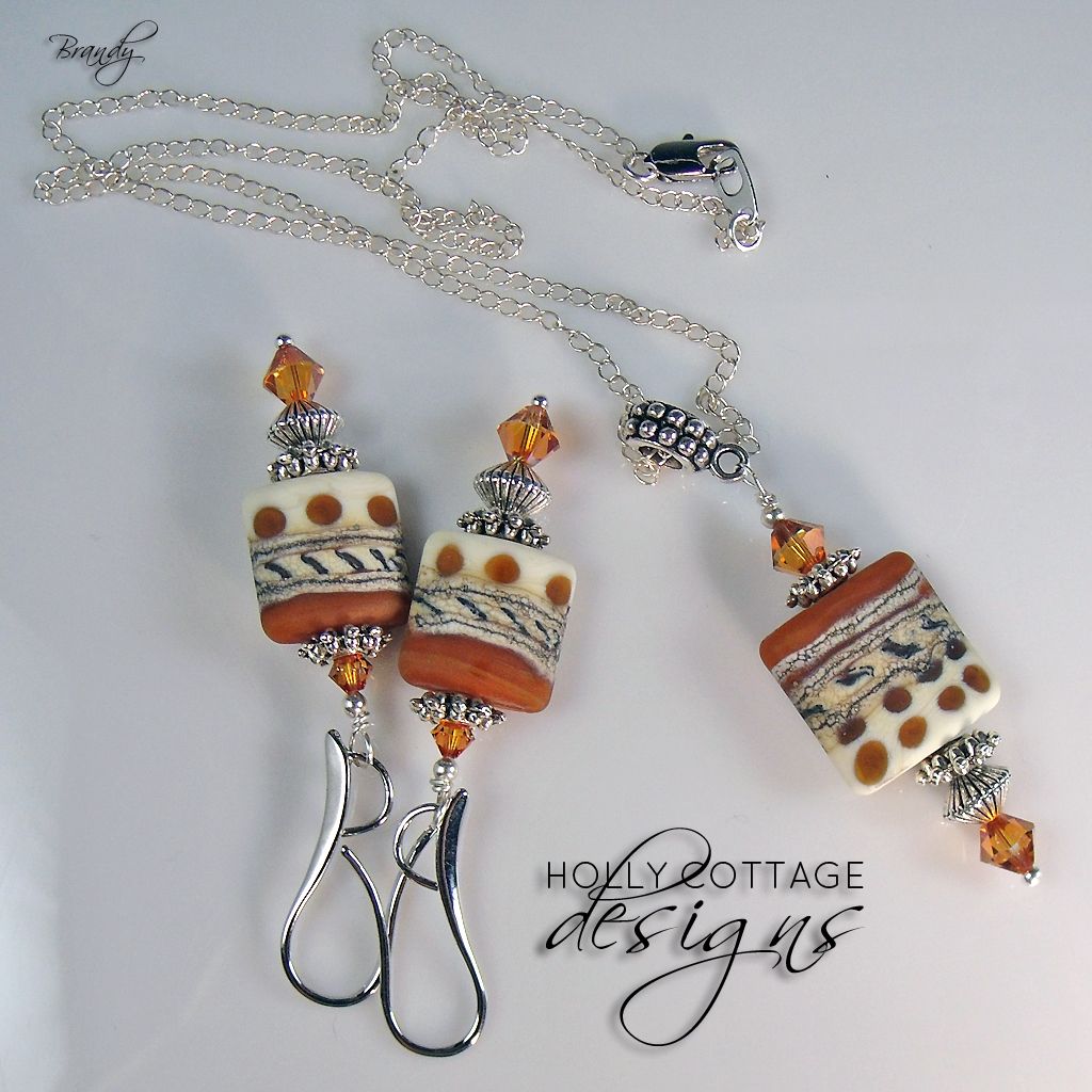 Artisan crafted lampwork pendant on chain with matching earrings Artisan crafted lampwork pendant on chain with matching earrings
