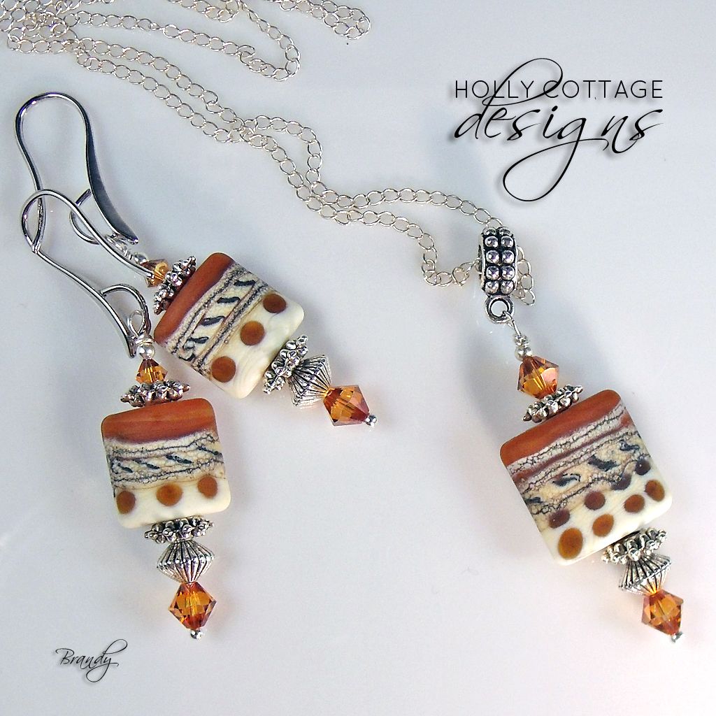 Artisan crafted lampwork pendant on chain with matching earrings Artisan crafted lampwork pendant on chain with matching earrings