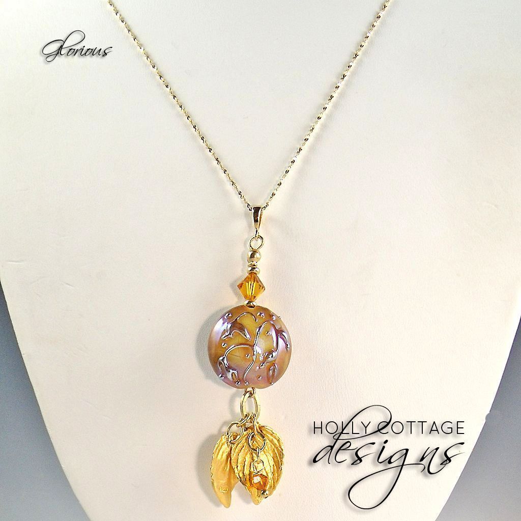 Artisan crafted lampwork pendant on gold plated chain Artisan crafted lampwork pendant on gold plated chain