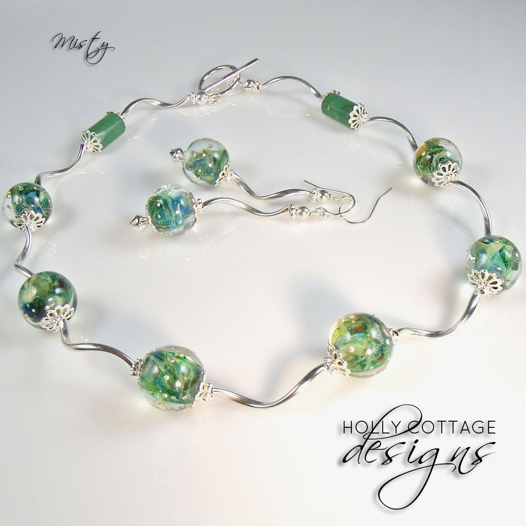 Artisan crafted necklace and earring set Artisan crafted necklace and earring set