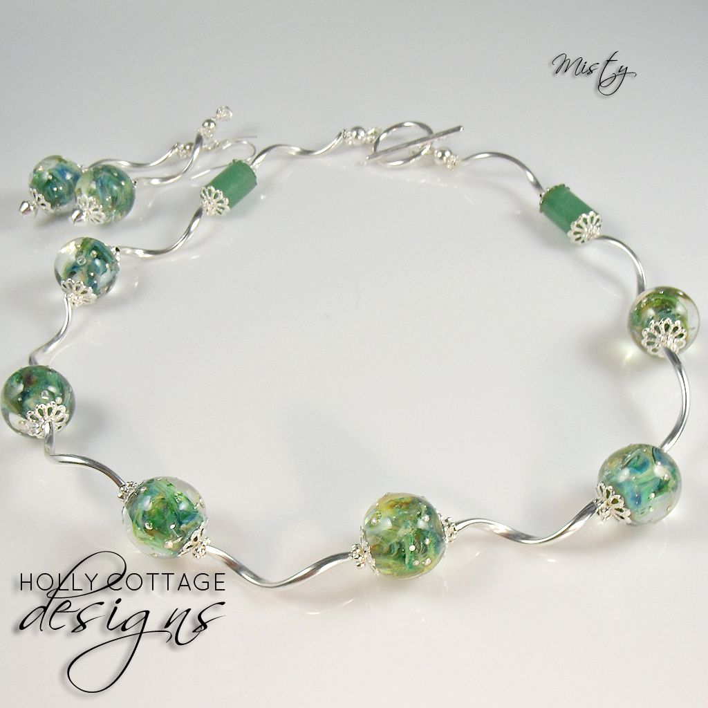 Artisan crafted necklace and earring set Artisan crafted necklace and earring set