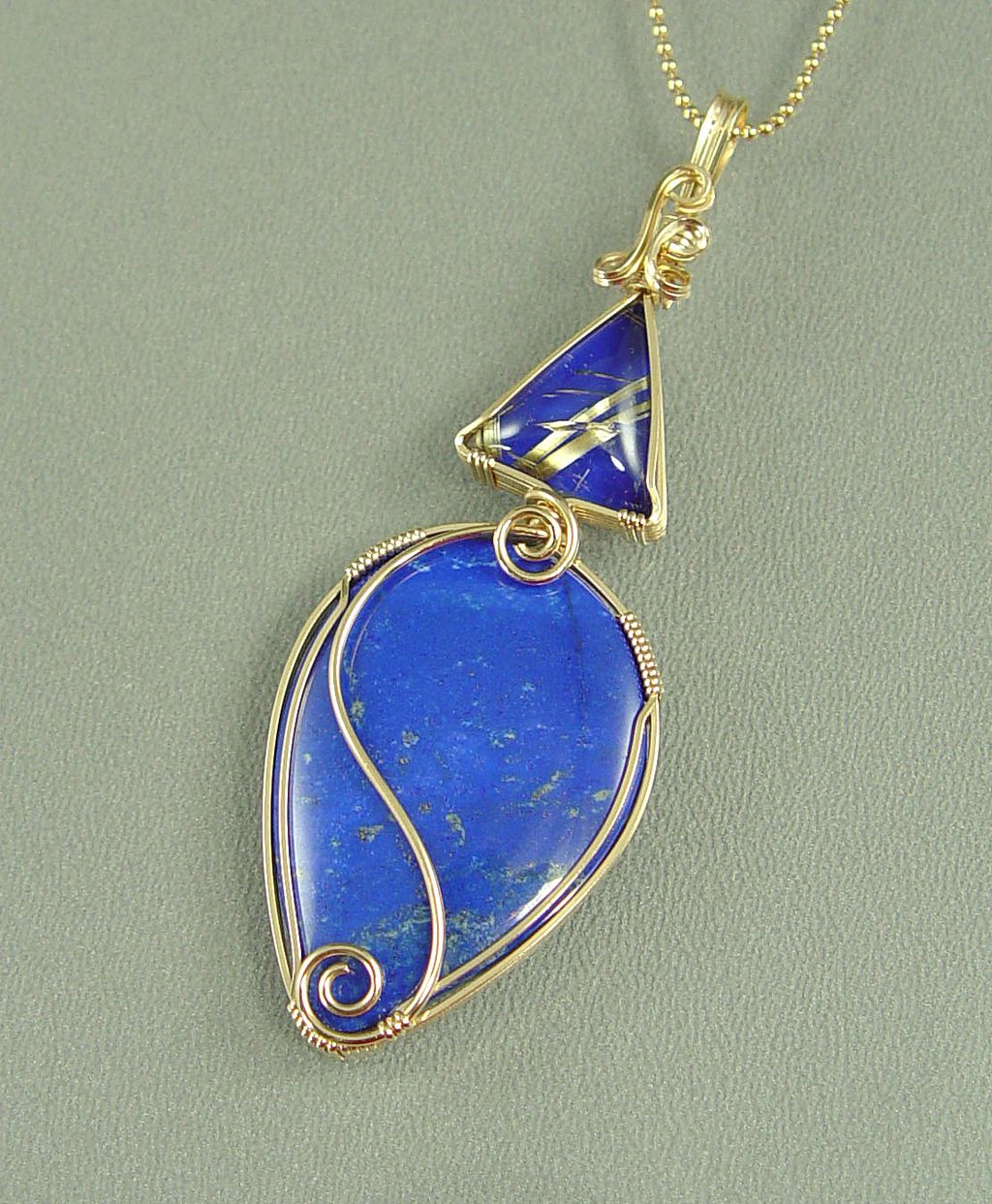 "Happy Blues" Lapis and Rutilated Quartz Wire-Wrapped Pendant "Happy Blues" Lapis and Rutilated Quartz Wire-Wrapped Pendant