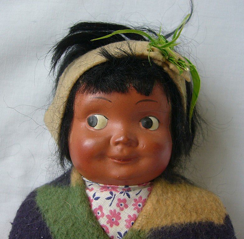 A Pair of Native American Cloth and Composition Dolls A Pair of Native American Cloth and Composition Dolls
