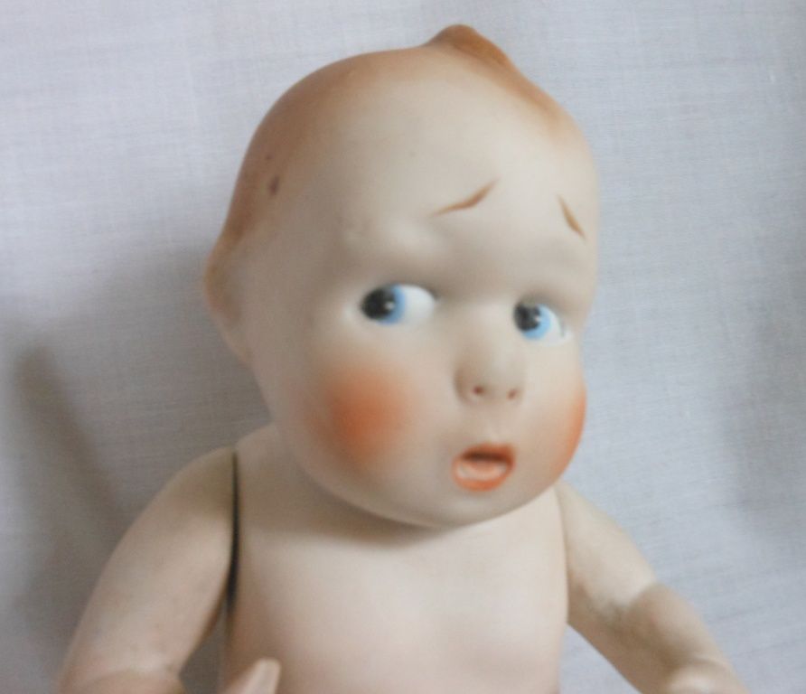 German All Bisque Character Baby with Worried Expression German All Bisque Character Baby with Worried Expression