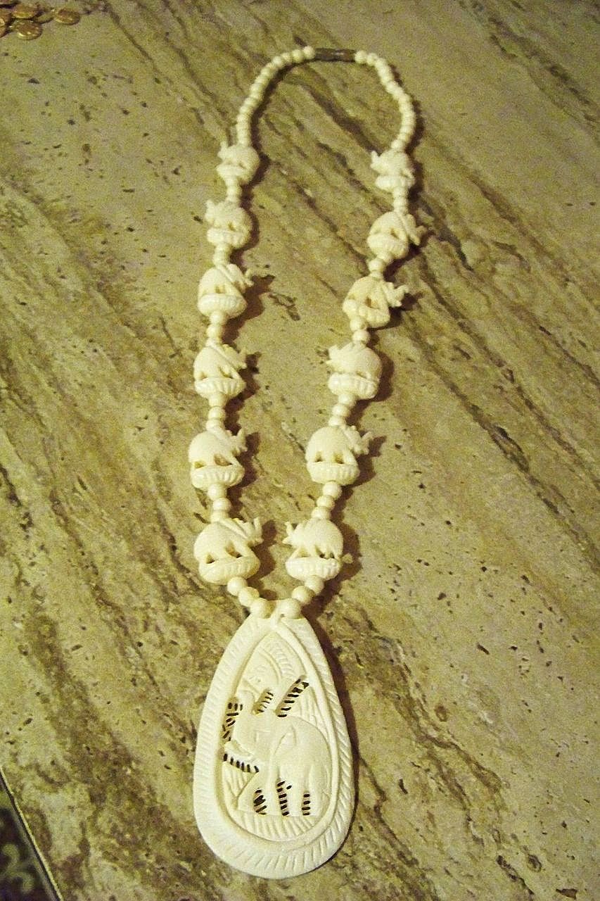 Carved Bone 13 Elephant Necklace w/ Screw Closure Carved Bone 13 Elephant Necklace w/ Screw Closure