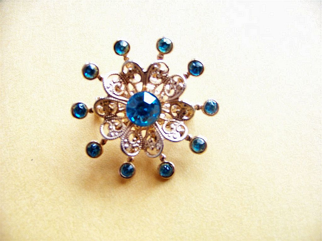 Star Bust Brooch Pin W Blue Rhinestones & Filigree Star Bust Brooch Pin W Blue Rhinestones & Filigree
