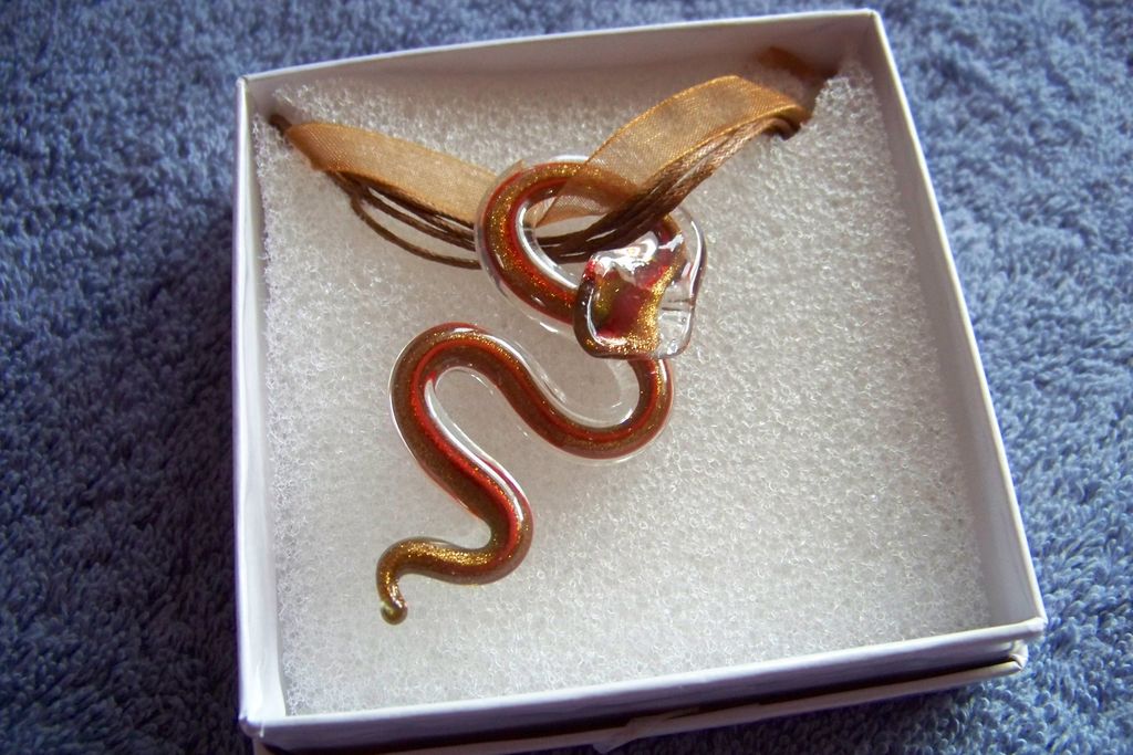 Brown Glass Snake, On Ribbon & 3 Small Cords Brown Glass Snake, On Ribbon & 3 Small Cords