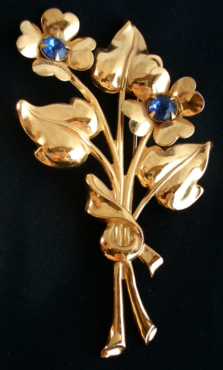 Vintage CORO Flower Bouquet pin with Blue Glass Stones Gold Tone Vintage CORO Flower Bouquet pin with Blue Glass Stones Gold Tone