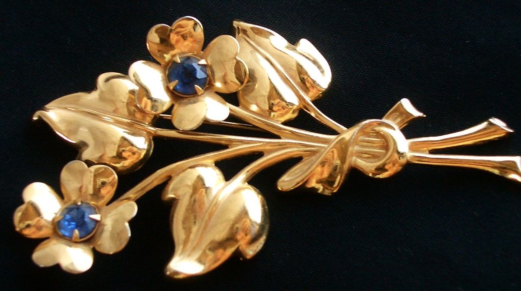 Vintage CORO Flower Bouquet pin with Blue Glass Stones Gold Tone Vintage CORO Flower Bouquet pin with Blue Glass Stones Gold Tone