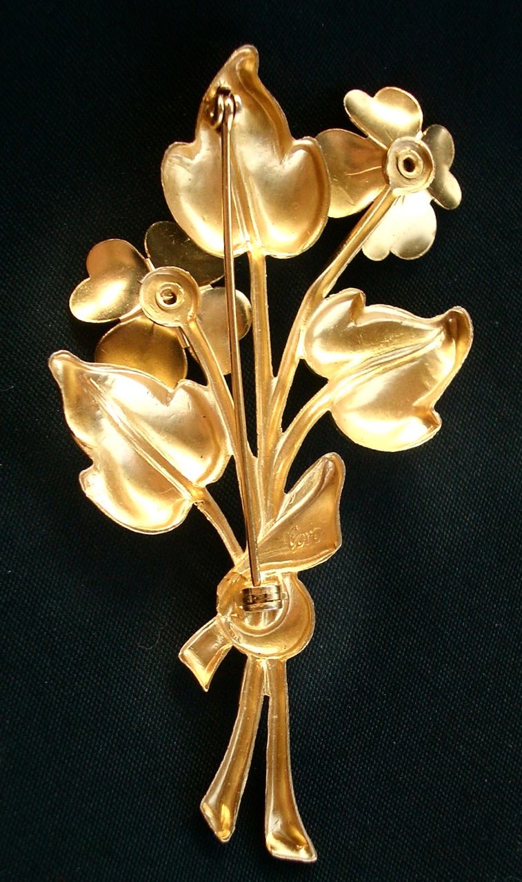 Vintage CORO Flower Bouquet pin with Blue Glass Stones Gold Tone Vintage CORO Flower Bouquet pin with Blue Glass Stones Gold Tone