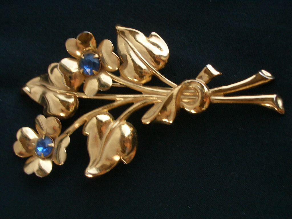 Vintage CORO Flower Bouquet pin with Blue Glass Stones Gold Tone Vintage CORO Flower Bouquet pin with Blue Glass Stones Gold Tone