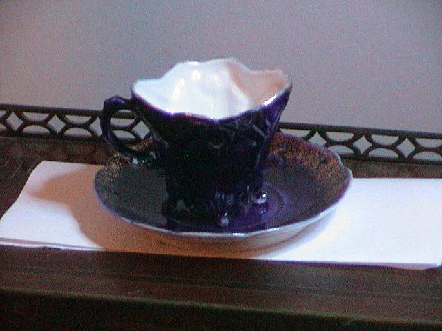 Flow Blue Cup and Saucer Flow Blue Cup and Saucer