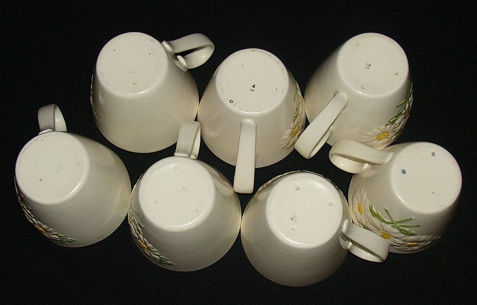 Metlox Poppy Trail "Sculptured Daisy" Cups, Set of 7 Metlox Poppy Trail "Sculptured Daisy" Cups, Set of 7
