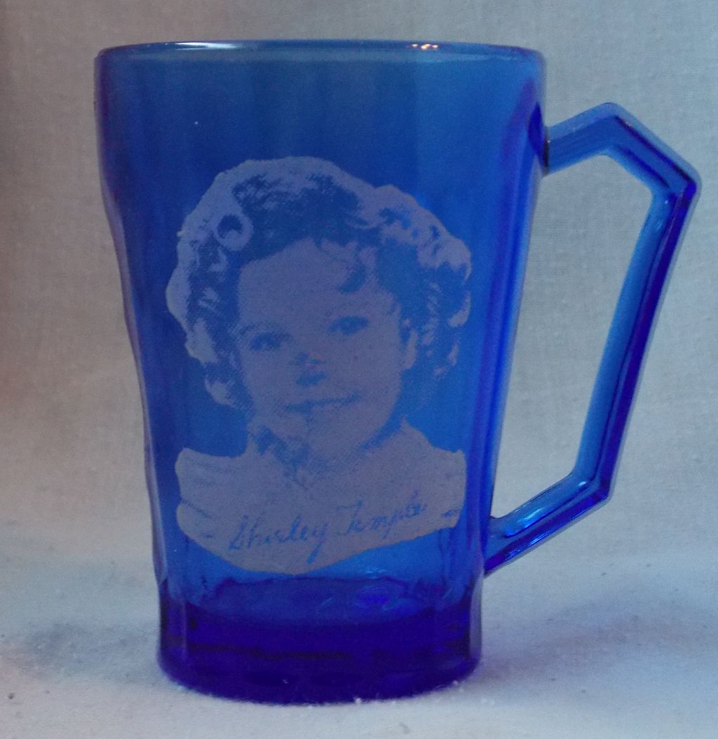 Shirley Temple Blue Glass Mug Circa. 1935 Shirley Temple Blue Glass Mug Circa. 1935