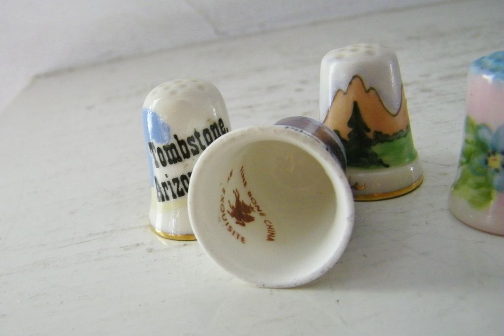 Four Fine China Souvenir Thimbles Four Fine China Souvenir Thimbles