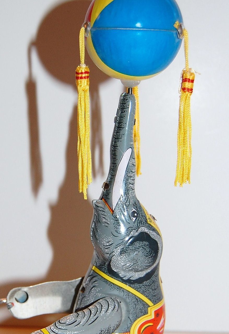 1970s Spinning Ball Tin Elephant Windup Toy from kitschandcouture on