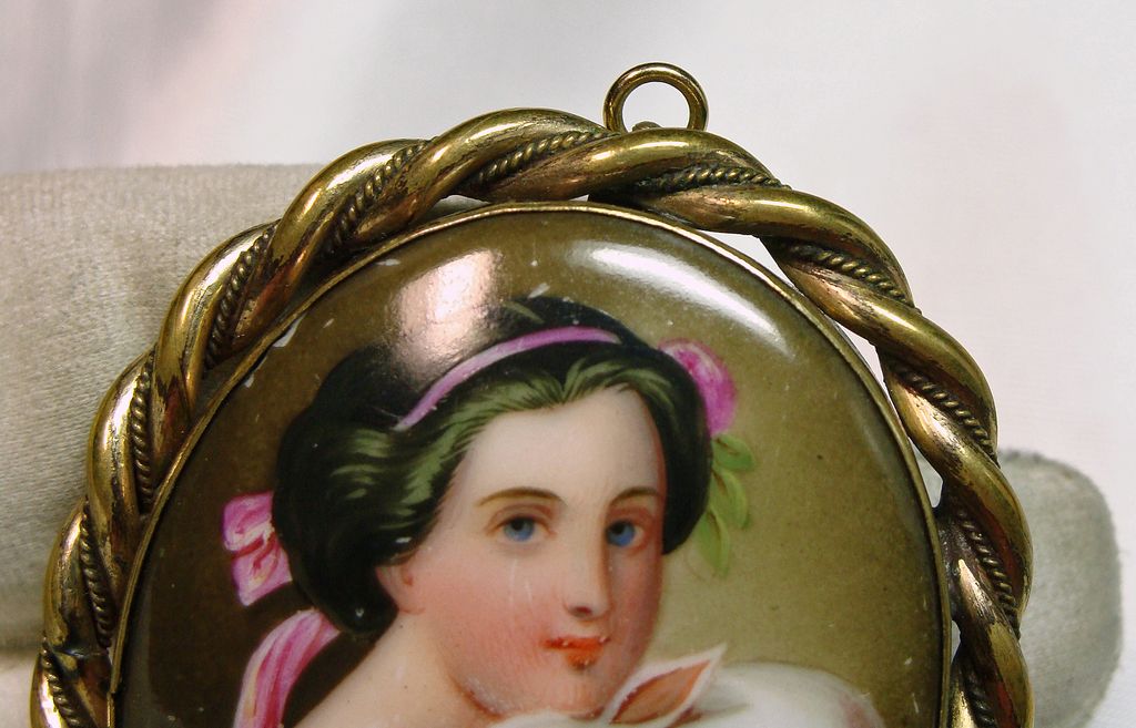 Victorian Gold Over Brass Broach Portrait of a Woman Holding a Bunny Victorian Gold Over Brass Broach Portrait of a Woman Holding a Bunny