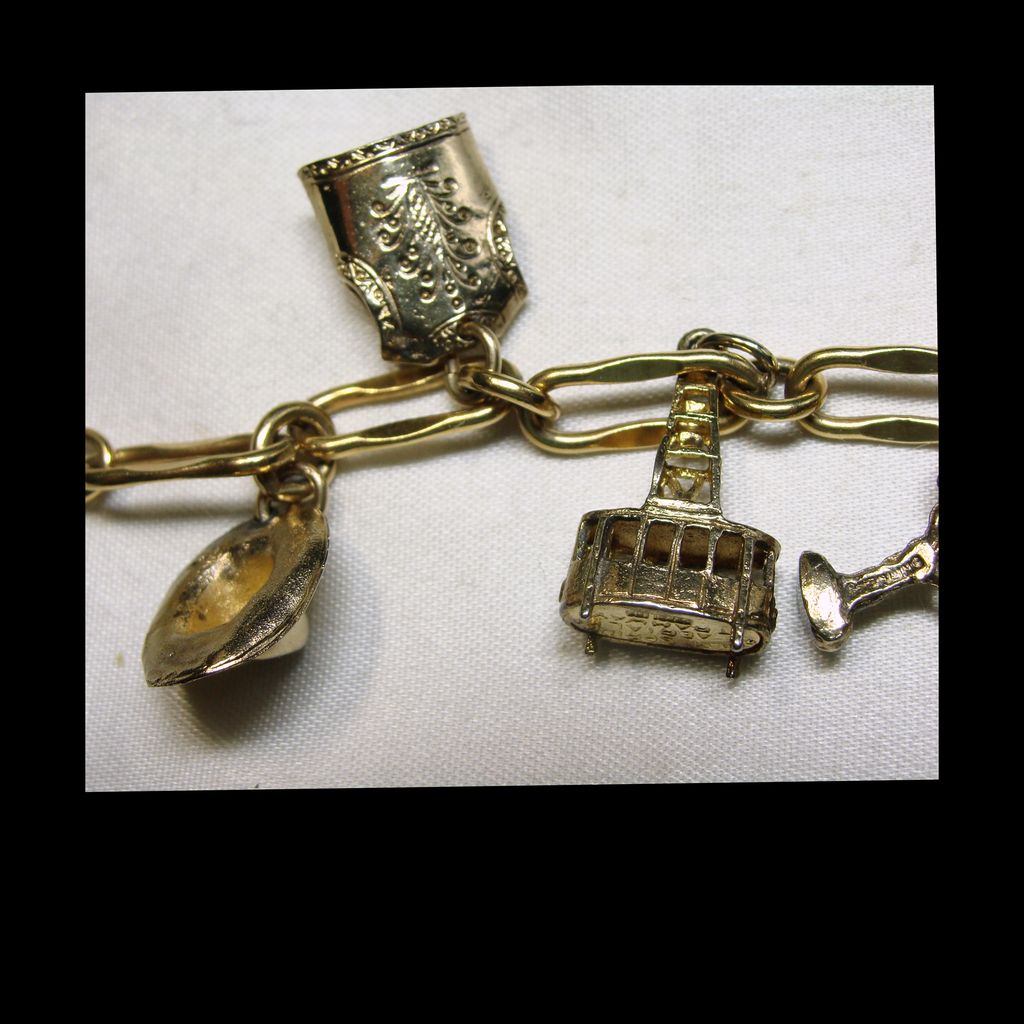 Early 1970s Palm Springs Gold Filled and Sterling Charm Bracelet Early 1970s Palm Springs Gold Filled and Sterling Charm Bracelet