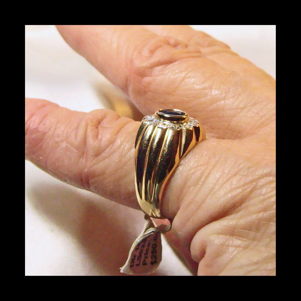 Sapphire Surrounded by Diamonds in a 14k Yellow Gold Ring Sapphire Surrounded by Diamonds in a 14k Yellow Gold Ring