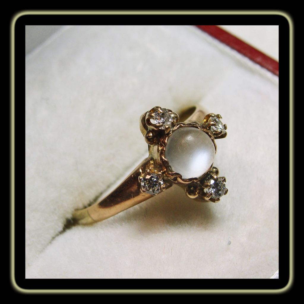 14k Rose Gold Ring with Moonstone Cabochon Accented by Diamonds 14k Rose Gold Ring with Moonstone Cabochon Accented by Diamonds