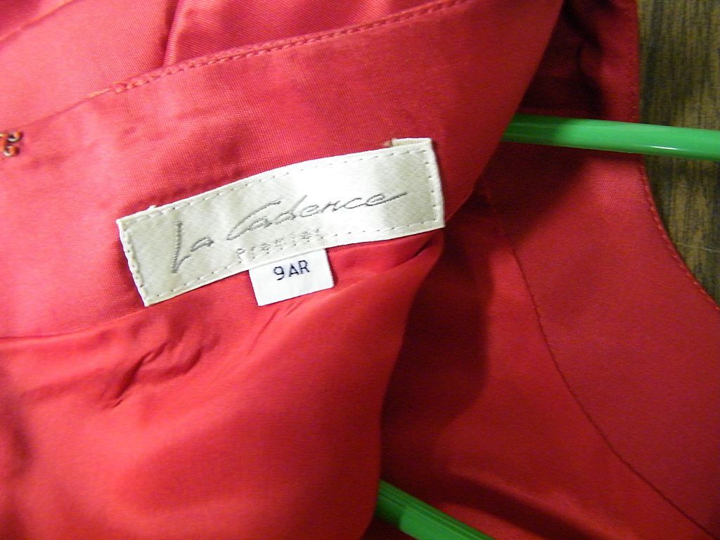 Red Taffeta Sheath With Side Pleated draped Peplin & Self Rose Flower At Waist..By La Cadence Premier Size 9 AR..Imported..Excellent Condition Red Taffeta Sheath With Side Pleated draped Peplin & Self Rose Flower At Waist..By La Cadence Premier Size 9 AR..Imported..Excellent Condition