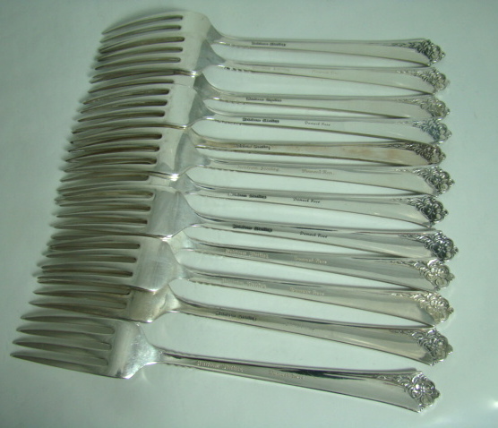 64-Piece Heirloom Sterling Silver Oneida Dinnerware Set `Damask Rose' Pattern Includes Storage Box Circa: 1946 64-Piece Heirloom Sterling Silver Oneida Dinnerware Set `Damask Rose' Pattern Includes Storage Box Circa: 1946