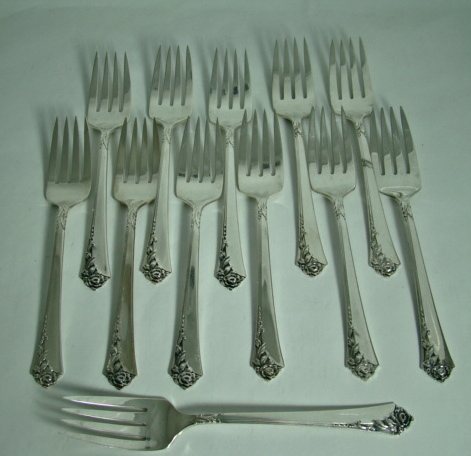 64-Piece Heirloom Sterling Silver Oneida Dinnerware Set `Damask Rose' Pattern Includes Storage Box Circa: 1946 64-Piece Heirloom Sterling Silver Oneida Dinnerware Set `Damask Rose' Pattern Includes Storage Box Circa: 1946