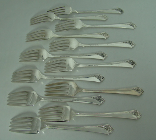 64-Piece Heirloom Sterling Silver Oneida Dinnerware Set `Damask Rose' Pattern Includes Storage Box Circa: 1946 64-Piece Heirloom Sterling Silver Oneida Dinnerware Set `Damask Rose' Pattern Includes Storage Box Circa: 1946