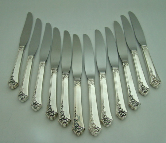 64-Piece Heirloom Sterling Silver Oneida Dinnerware Set `Damask Rose' Pattern Includes Storage Box Circa: 1946 64-Piece Heirloom Sterling Silver Oneida Dinnerware Set `Damask Rose' Pattern Includes Storage Box Circa: 1946