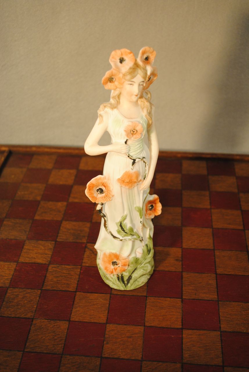 German Porcelain Figure with Poppies German Porcelain Figure with Poppies