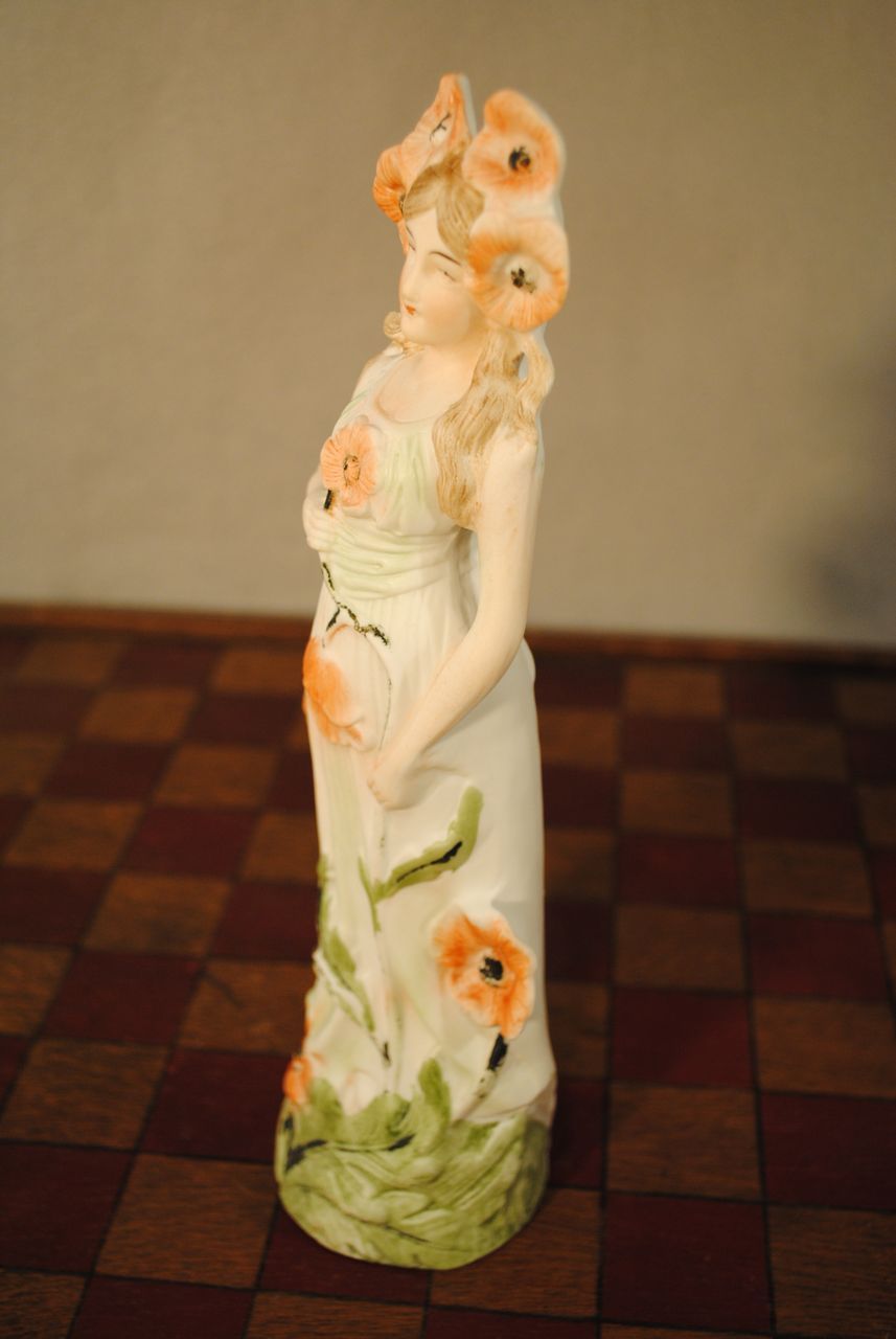 German Porcelain Figure with Poppies German Porcelain Figure with Poppies