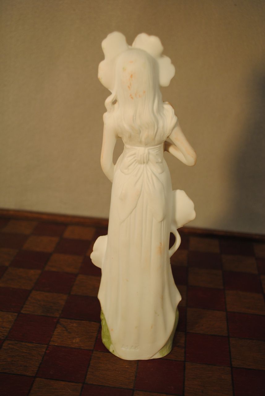 German Porcelain Figure with Poppies German Porcelain Figure with Poppies
