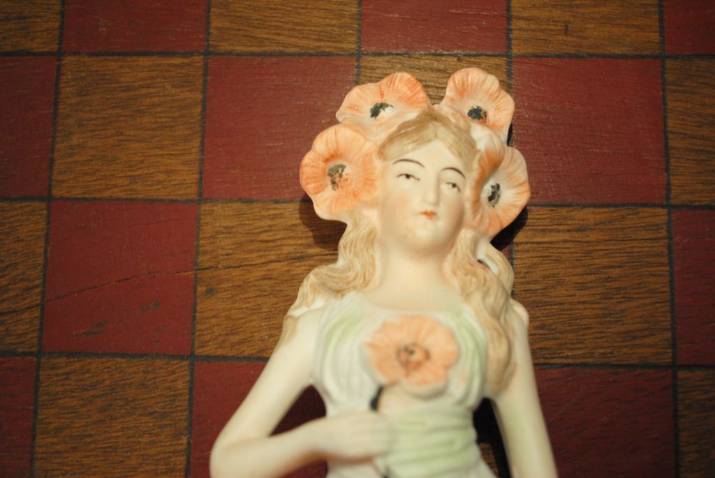 German Porcelain Figure with Poppies German Porcelain Figure with Poppies