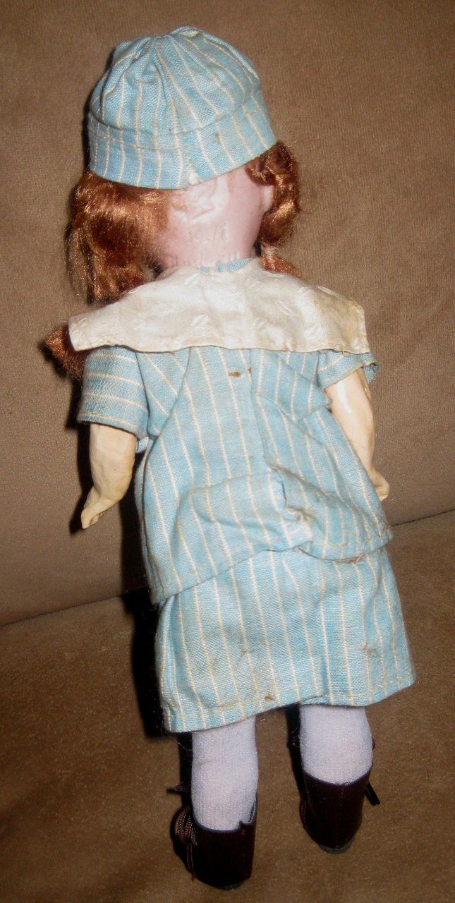 12" Mystery German Bisque Doll in Original Clothes. 12" Mystery German Bisque Doll in Original Clothes.