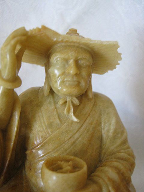 Hard Stone Carving of Elderly Holding Bowl Hard Stone Carving of Elderly Holding Bowl