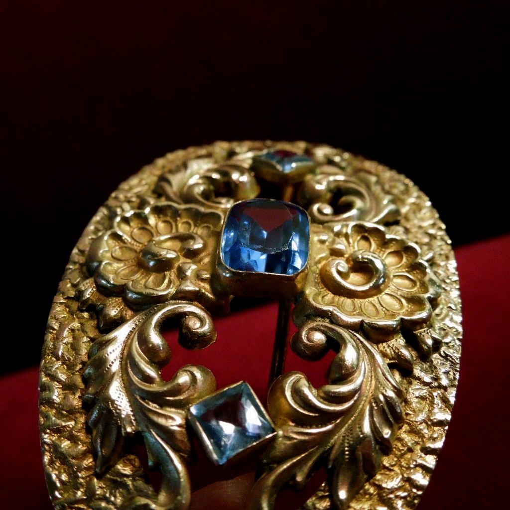 Brass and Light Sapphire Oval Art Nouveau Brooch Brass and Light Sapphire Oval Art Nouveau Brooch