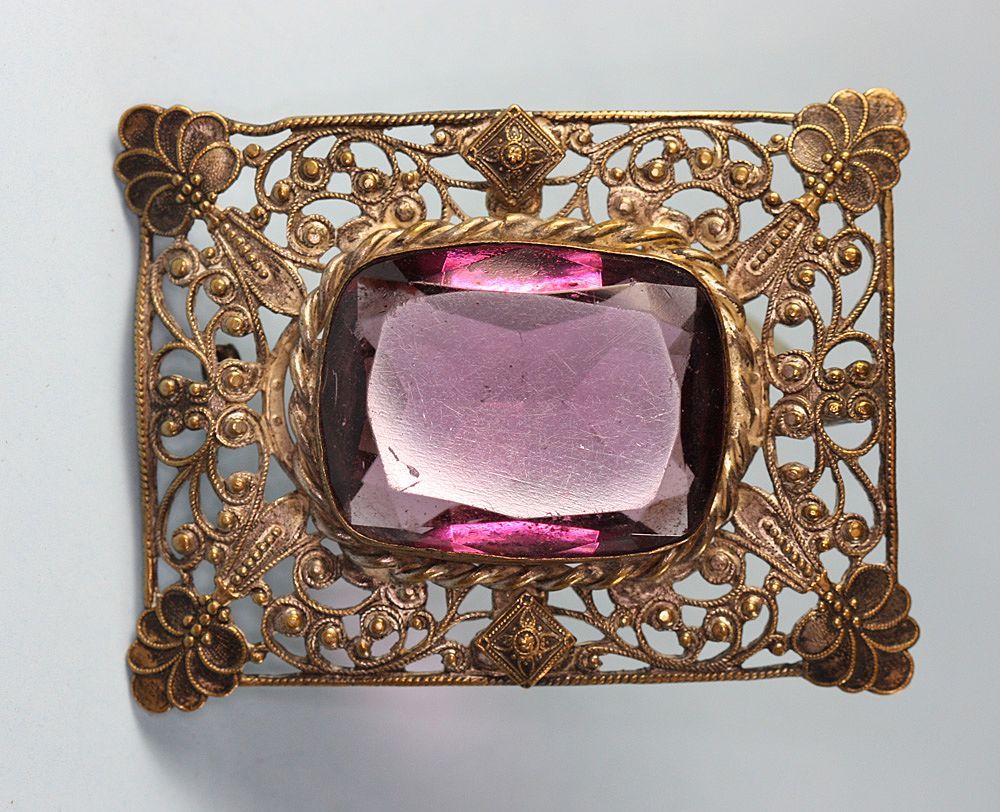 Art Nouveau Filigree Brooch with Amethyst Colored Stone Art Nouveau Filigree Brooch with Amethyst Colored Stone