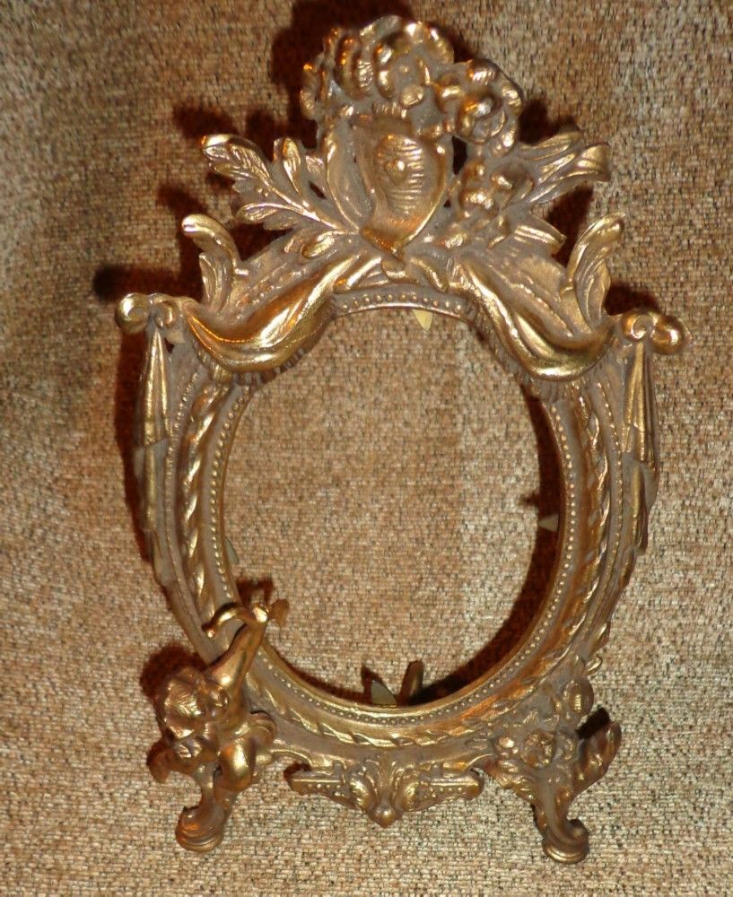 French Rococo Gilt Brass Frame With Cherub Decoration French Rococo Gilt Brass Frame With Cherub Decoration