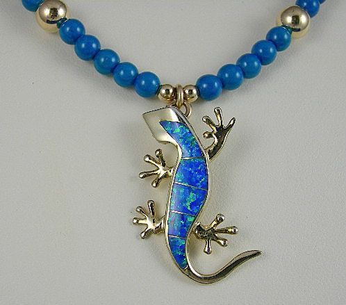 A Miniature Opal And Golden Vermeil Gecko A Miniature Opal And Golden Vermeil Gecko