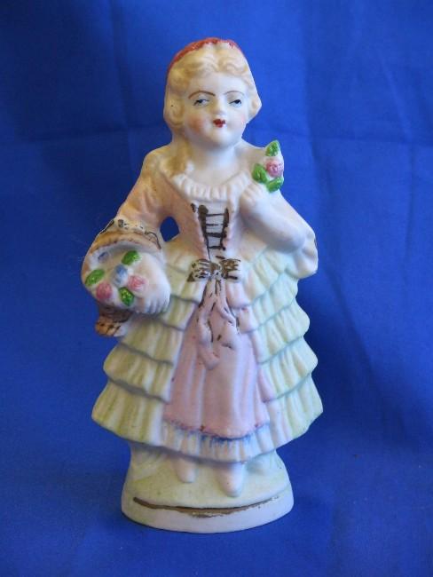 Bisque Figurine of Lady with Basket of Flowers Made in Japan Bisque Figurine of Lady with Basket of Flowers Made in Japan