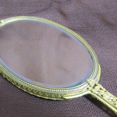 Vintage signed Apollo luxury hand mirror ormolu frame pierced floral handle Vintage signed Apollo luxury hand mirror ormolu frame pierced floral handle