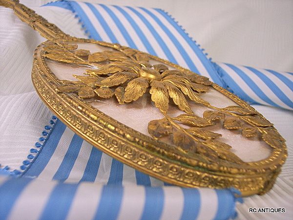 Vintage signed Apollo luxury hand mirror ormolu frame pierced floral handle Vintage signed Apollo luxury hand mirror ormolu frame pierced floral handle