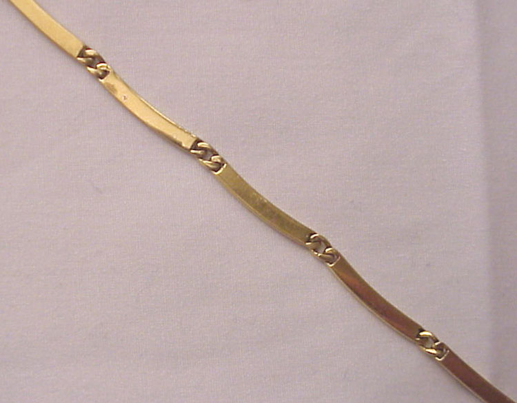 Gucci 18Kt. Gold Necklace With Enamel Accented Indian Heads Gucci 18Kt. Gold Necklace With Enamel Accented Indian Heads