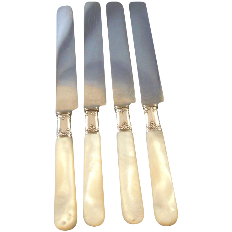 Mother of pearl dinner knives sterling ferrules (4) Mother of pearl dinner knives sterling ferrules (4)